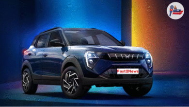 Mahindra XUV 3XO SUV in dark blue shade with futuristic LED headlamps and bold styling – showcased in a vibrant spotlight.