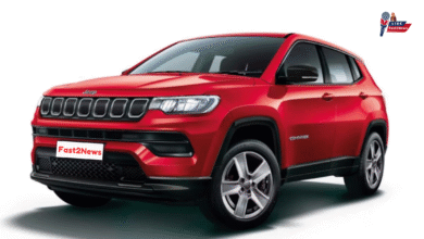 Red Jeep Compass 2025 SUV front view with Fast2News branding on number plate
