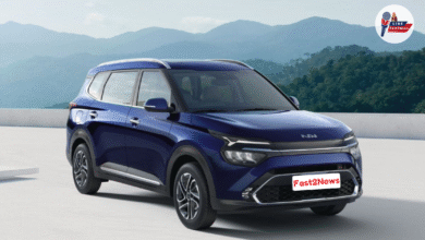 KIA Motors : Blue Kia SUV with modern design parked against mountain backdrop – Fast2News Auto Segment